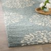 cowden-exploded-medallions-woven-bay-blue-area-rug.jpg